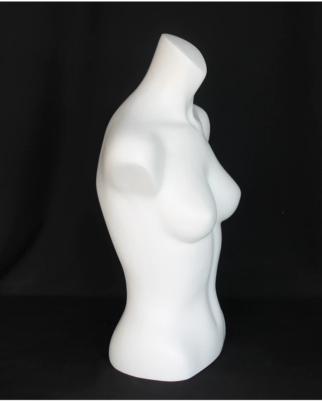 Headless female torso form in matte white