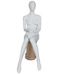 Hands-in-lap sitting egghead female mannequin in matte white, front view