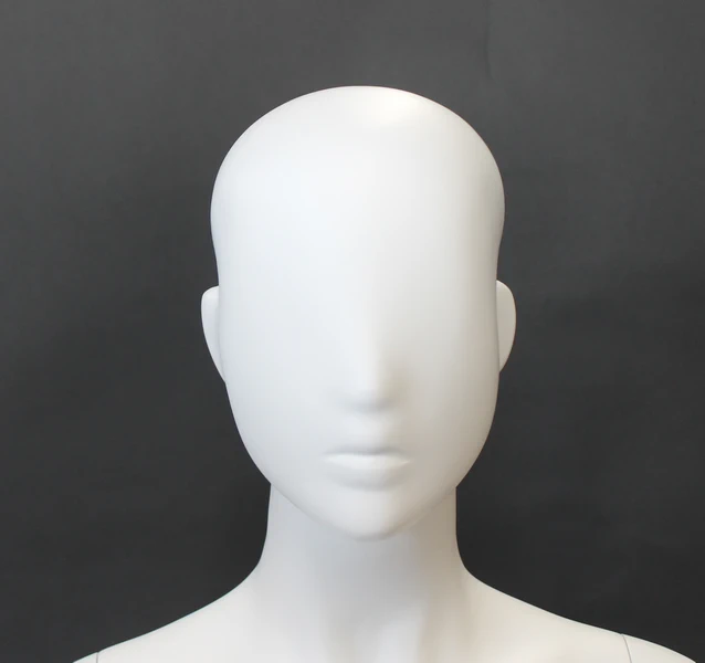 Upright abstract female mannequin in matte white