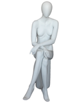 Crossed-leg sitting egghead female mannequin in matte white, front view