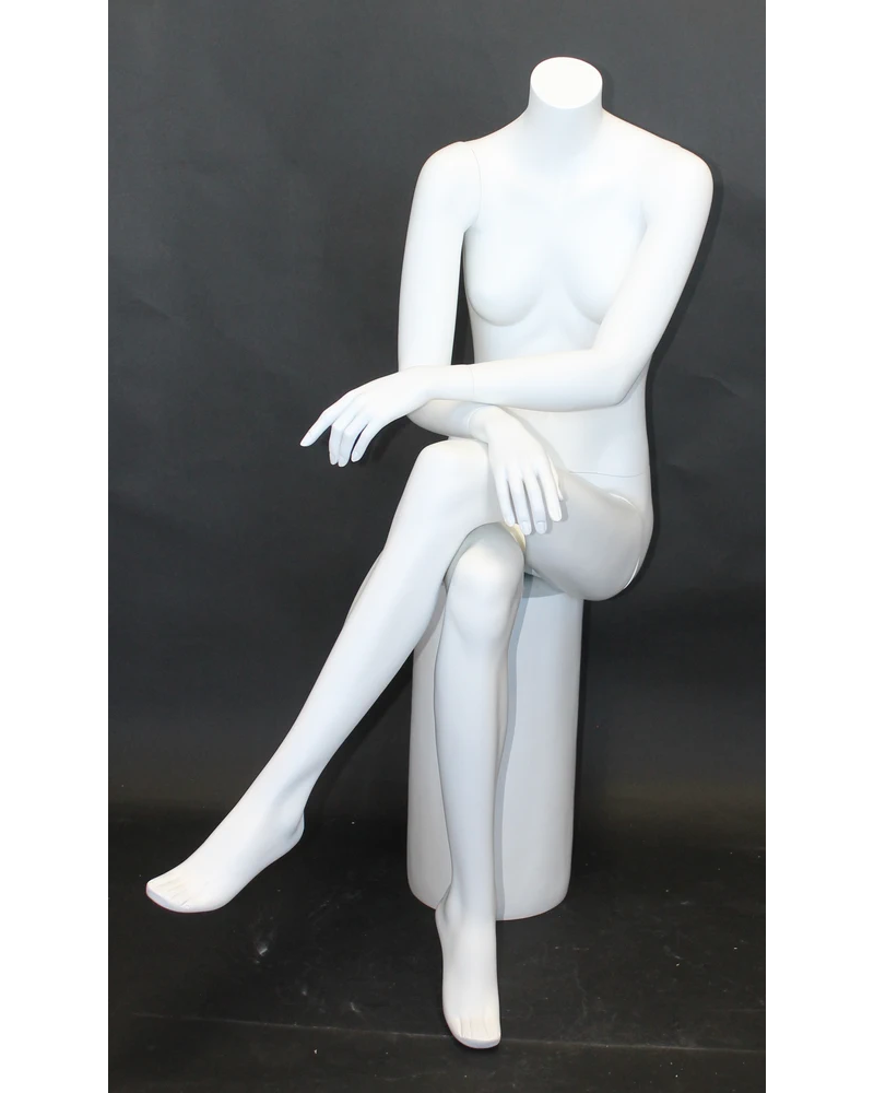 Crossed-leg seated headless female mannequin in matte white