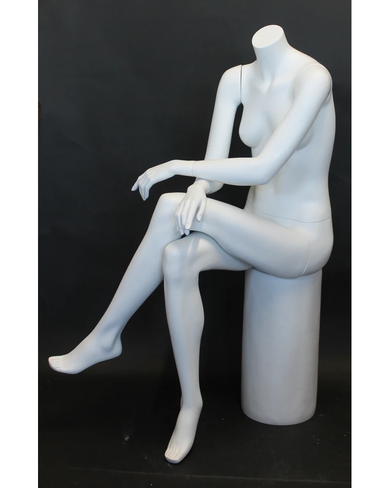 Crossed-leg seated headless female mannequin in matte white
