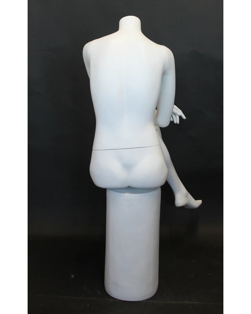 Crossed-leg seated headless female mannequin in matte white