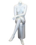 Crossed-leg seated headless female mannequin in matte white