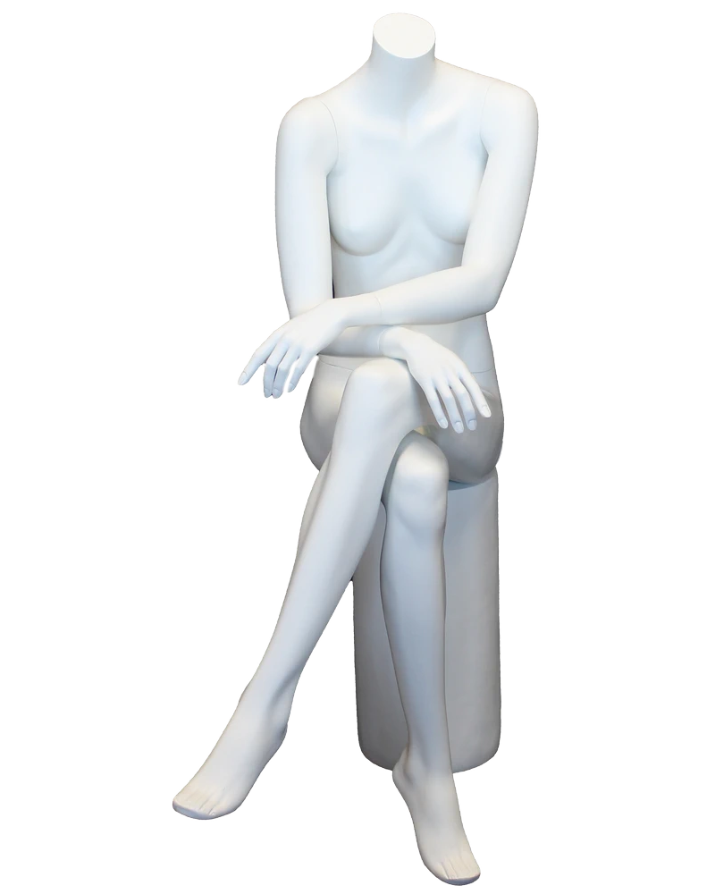 Crossed-leg seated headless female mannequin in matte white