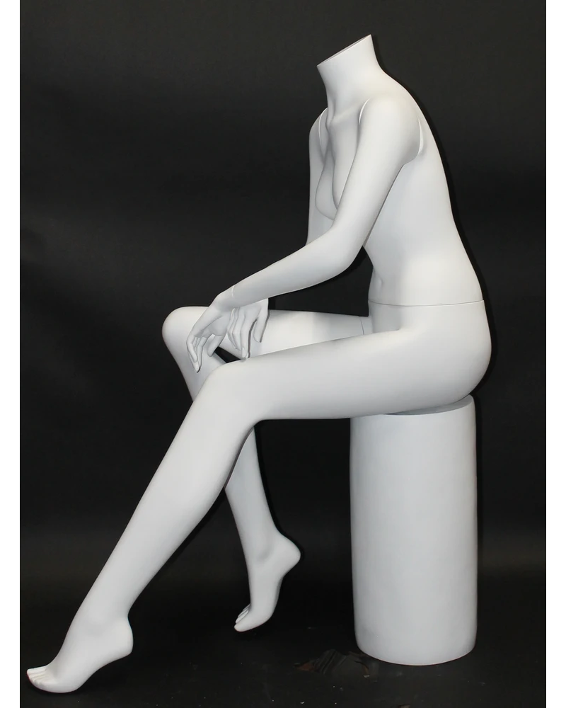 Seated headless female mannequin in matte white